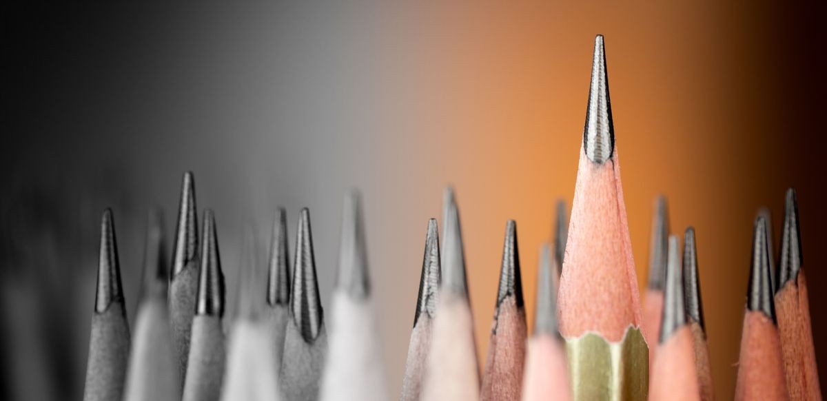 One pencil standing out from the group of other pencil.Leadership and growth in business concept.
